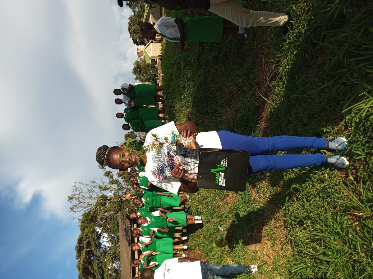 Tree planting at Dekut conservancy during a girls school me…